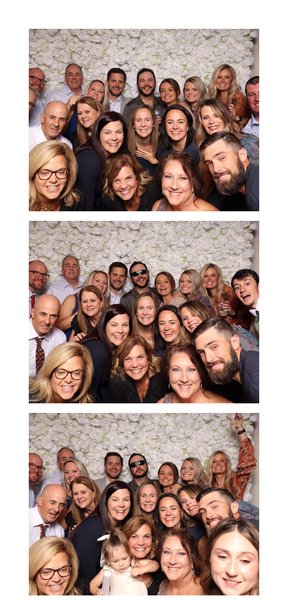 A large group in front of a white flower wall in a three-frame photo strip.